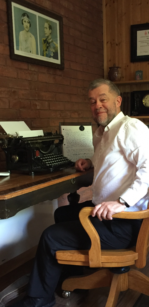 Picture of Larry Patriquin writing at home at his paternal grandmother’s kitchen table, with the chair and typewriter used by his father, who worked as a clerk for Canadian National Railways from the late 1940s to the early 1980s. (Typewriter appears for effect only; author knows how to use computers.)